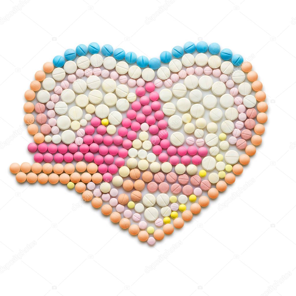 Creative medicine and healthcare concept made of drugs and pills, isolated on white. ECG, a human heart with a heartbeat line.