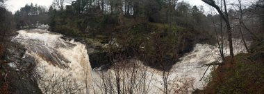 Falls of Clyde waterfall in New Lanark, Lanarkshire, Scotland