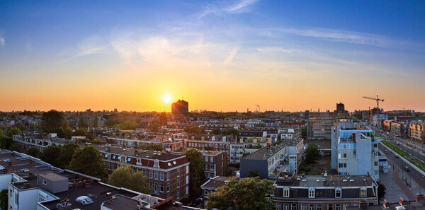 Beautiful cityscape looking over the city of Amsterdam in the Netherlands at sunset