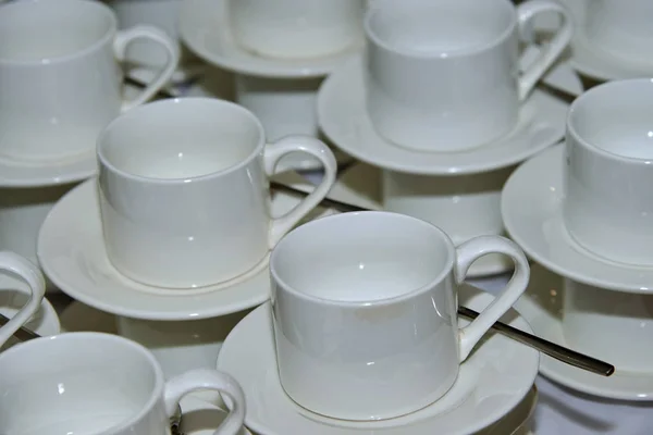 Empty white cup for tea.A teacup is a cup, with or without a handle, generally a small one that may be grasped with the thumb and one or two fingers.