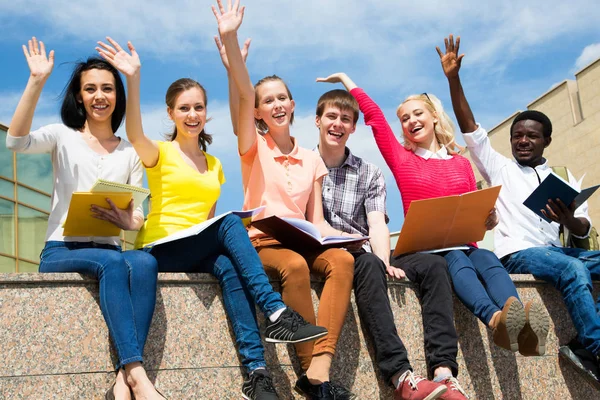 Excited Students Arms Outstretched Outdoors — Stock Photo, Image