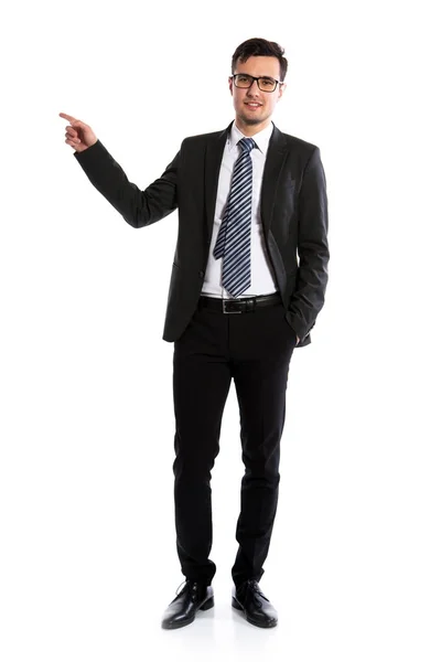 Smiling businessman pointing at space — Stock Photo, Image