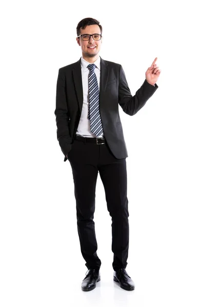 Smiling businessman pointing at space — Stock Photo, Image