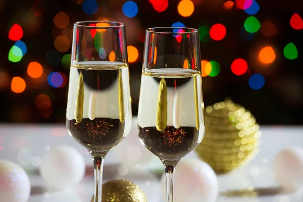 Red wine glasses and christmas balls — Stock Photo, Image