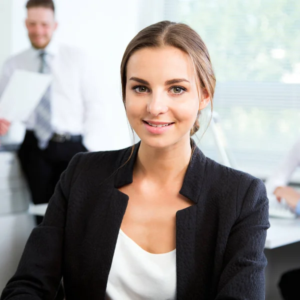 Young businesswoman with colleagues — Stock Photo, Image