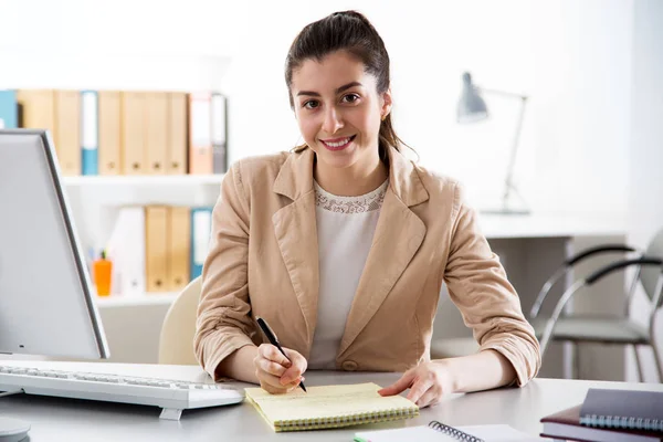 Young business woman using computer at office — Stockfoto