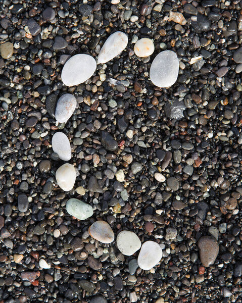 alphabet  laid on a black sand