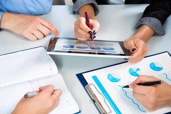 Businesspeople analyzing financial data