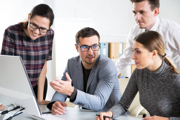 Businesspeople discuss a new project in the office