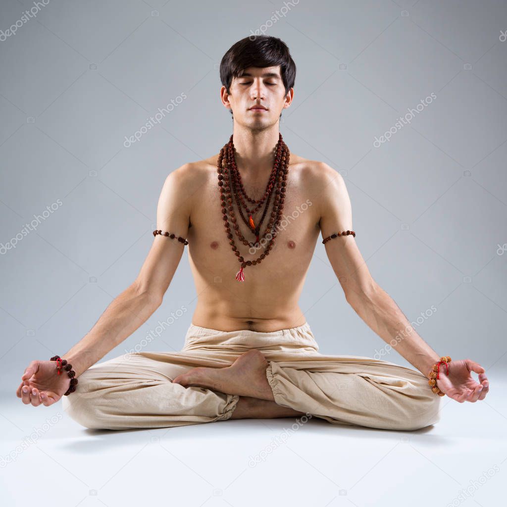 Young man doing yoga 