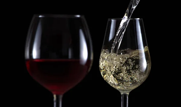 Beautiful splash of wine in a glasses — Stock Photo, Image