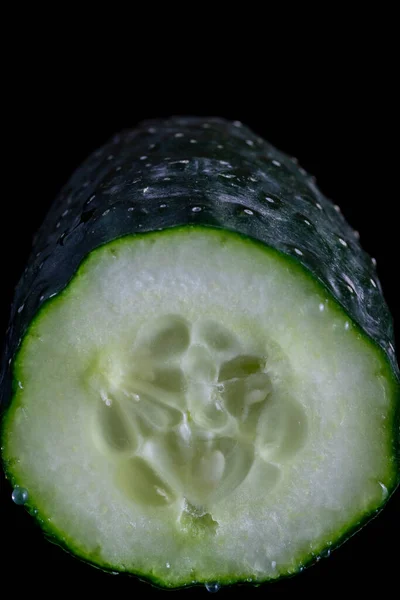 Split Cucumber Showing Its Releasing Its Juice Black Methacrylate Background — Stock Photo, Image