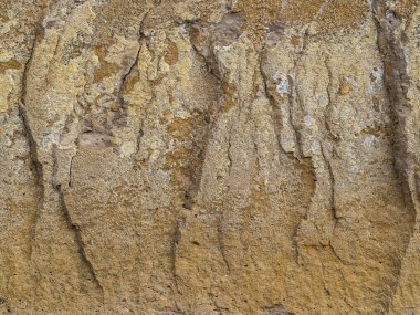 Çatlakların dikey çizimlerine sahip bir kayanın ayrıntıları