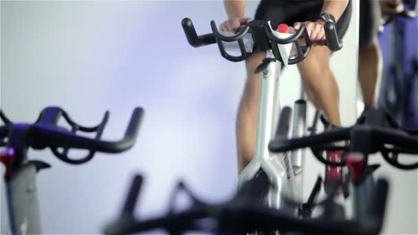 Spinning class: changing gear and constant speed — Stock Video