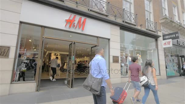 Oxford Street Shoppers Passing The H M Fashion Store London Uk