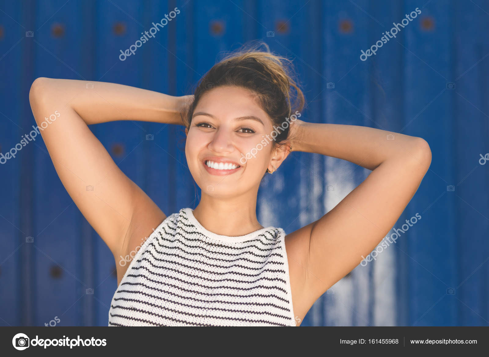 https://st3.depositphotos.com/3282321/16145/i/1600/depositphotos_161455968-stock-photo-young-happy-woman-on-blue.jpg
