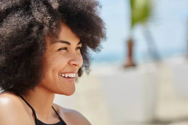 Young happy afro american woman looking away