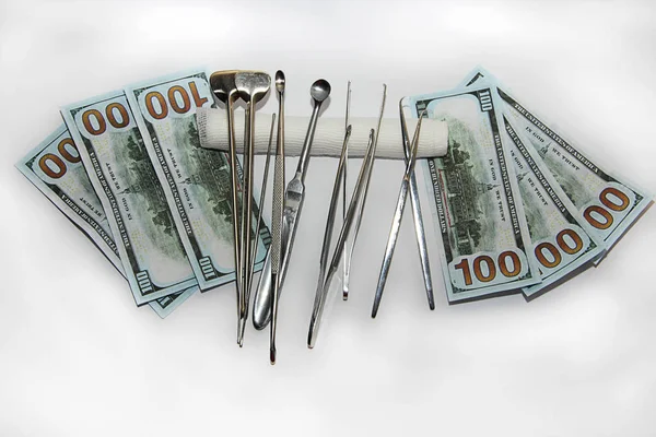 paid medicine money bandages and tools for surgery