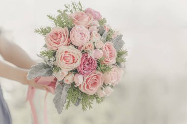 Beautiful valentine bouquet with woman hands 