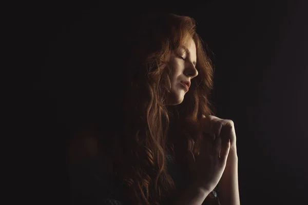 Sensual model with curly hair in the shadows — Stock Photo, Image