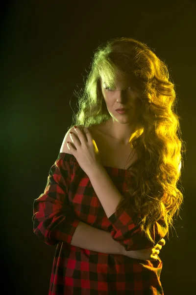 Luxurious model with curly hair in the shadows — Stock Photo, Image