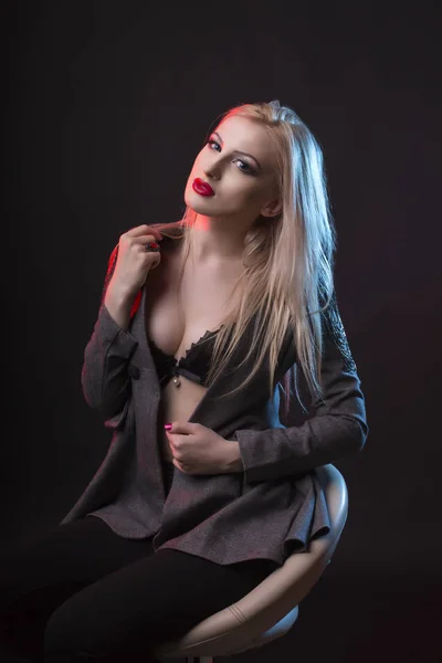 Attractive blonde woman in a black lingerie and jacket — Stock Photo, Image