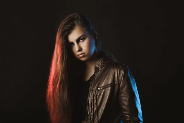 Wondeful stylish woman posing at studio with red and blue light — Stock Photo, Image