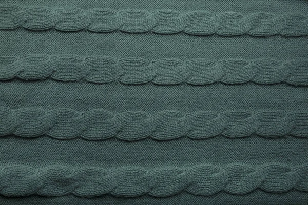 Фон из зеленой шерсти вязаный свитер — стоковое фото