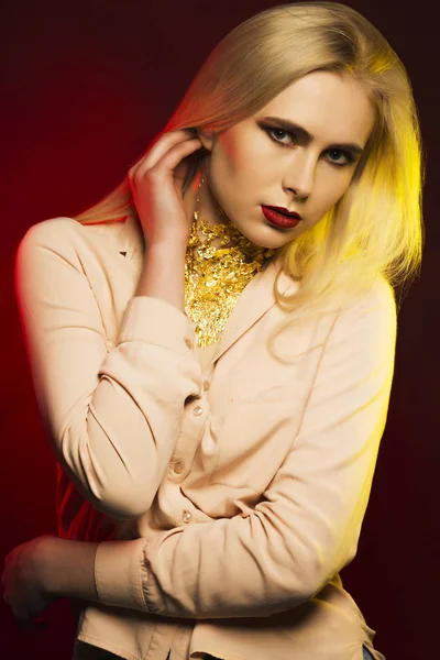 Elegant woman with bright makeup and gold foil on her neck — Stock Photo, Image