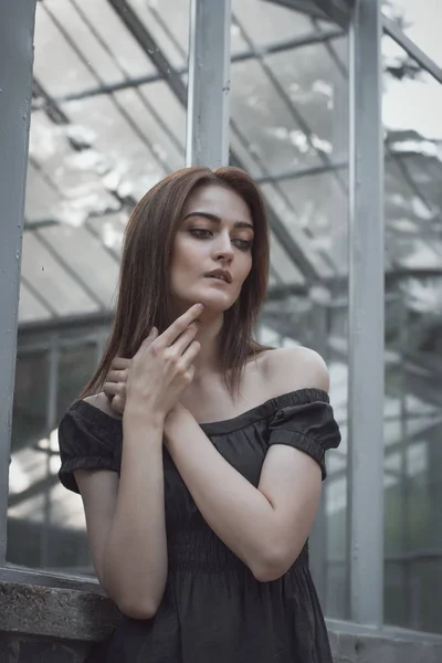 Sexy woman in black dress at the window — Stock Photo, Image