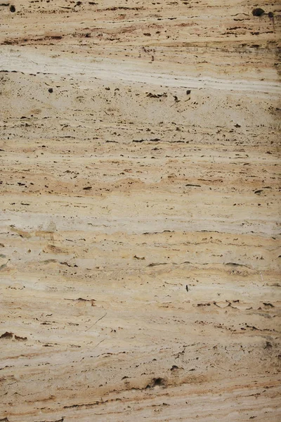 Textur aus hellbeigem Marmor auf einer Fassade des Gebäudes — Stockfoto