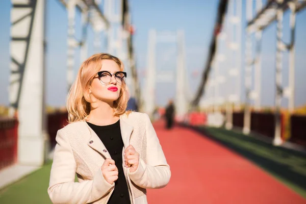 Fashion portrait of luxury blonde model wears clear glasses and — Stock Photo, Image