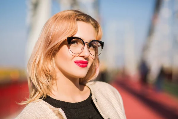 Young lovely model wears clear glasses with bright makeup posing — Stock Photo, Image
