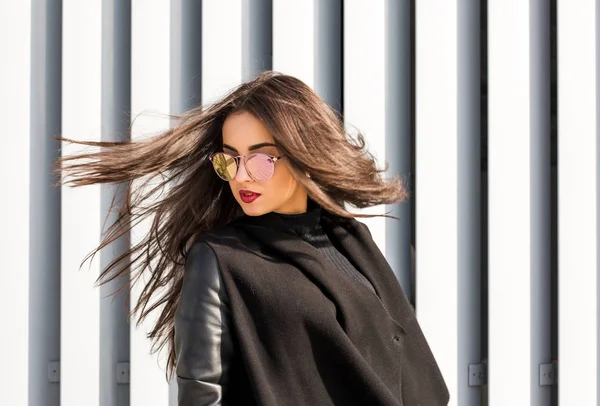 Closeup portrait of smiling young model in sunglasses with hair — Stock Photo, Image