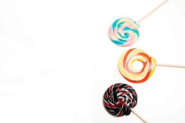 New Year's colorful sweets on a white background. Empty space — Stock Photo, Image