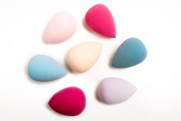 Closeup photo of colorful beauty blenders on a white background — Stock Photo, Image