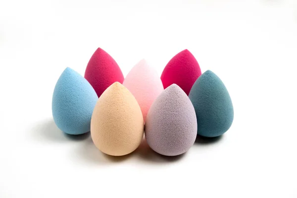 Closeup shot of cosmetic foundation sponges on a white backgroun — Stock Photo, Image