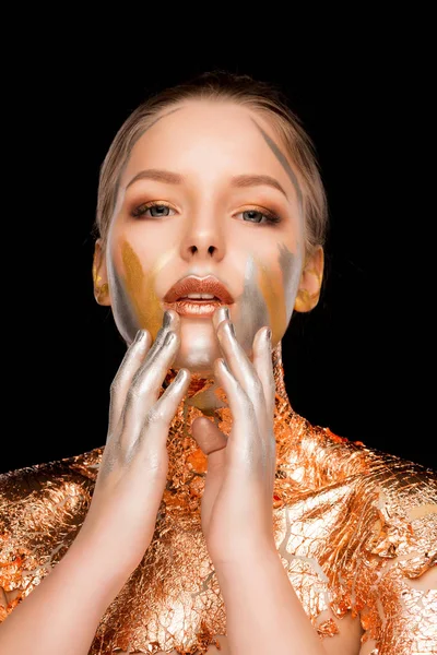Beautiful young model with professional makeup and gold foil on — Stock Photo, Image