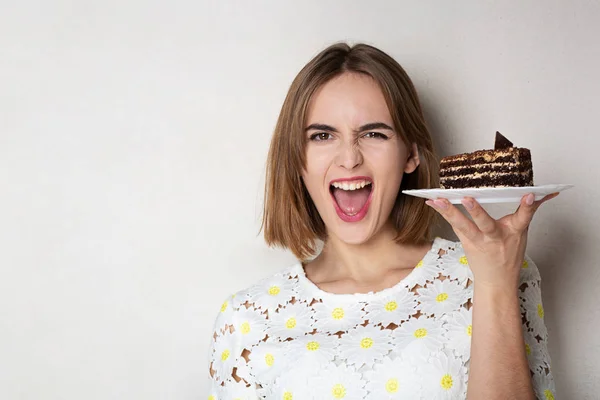 Excited girl holding yummy cake — Stock Photo, Image