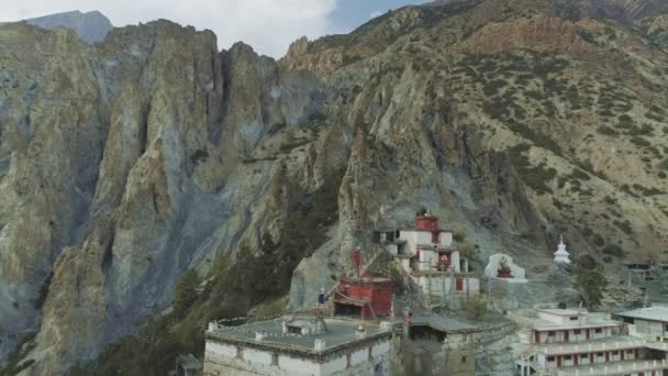 Aerial panning at crests cliffs, solituded windy Braga monastery on a slope — Stock Video