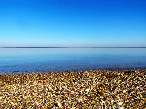 Calm sea against the blue sky