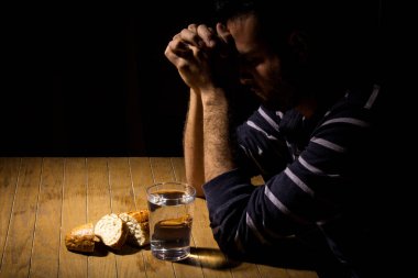 Fasting for bread and water to strengthen the spirit clipart