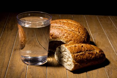 Fasting for bread and water to strengthen the spirit clipart