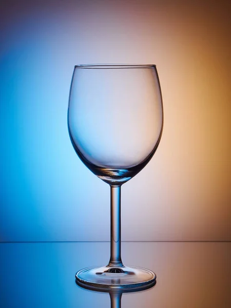 Glass close-up neon colored light gradient background