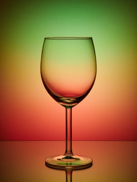 Glass close-up neon colored light gradient background