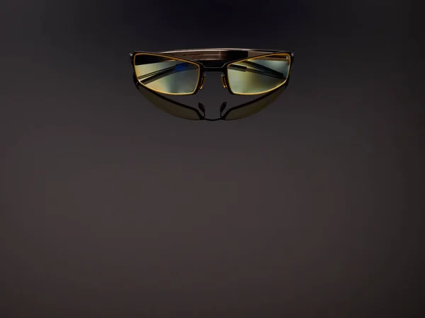 Computer game protective UV glasses on a gray gradient background — Stockfoto