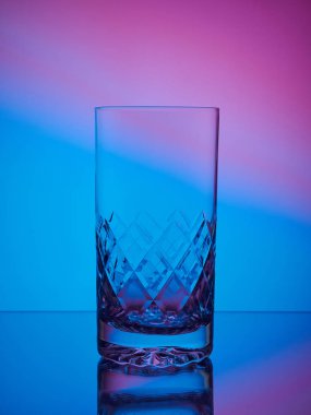 Glass close-up neon colored light gradient background