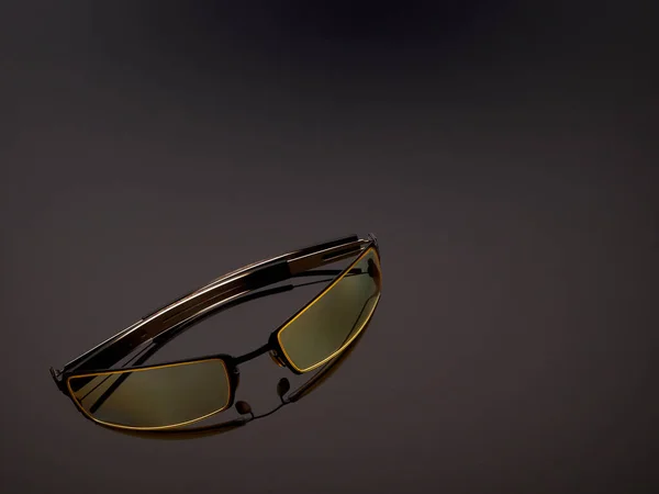 Computer game protective UV glasses on a gray gradient background