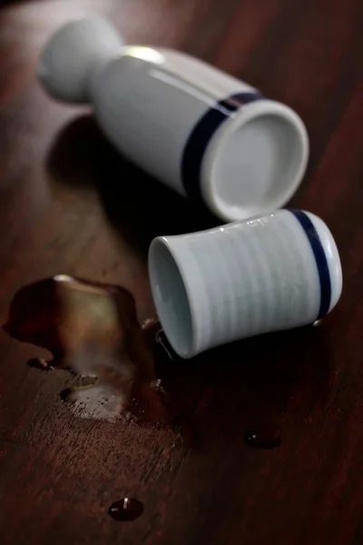 Spilt japońskiej Sake — Zdjęcie stockowe