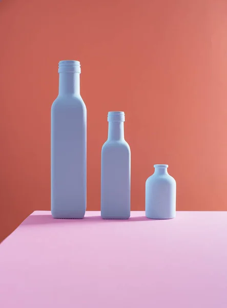 Tre flaskor på bakgrund — Stockfoto